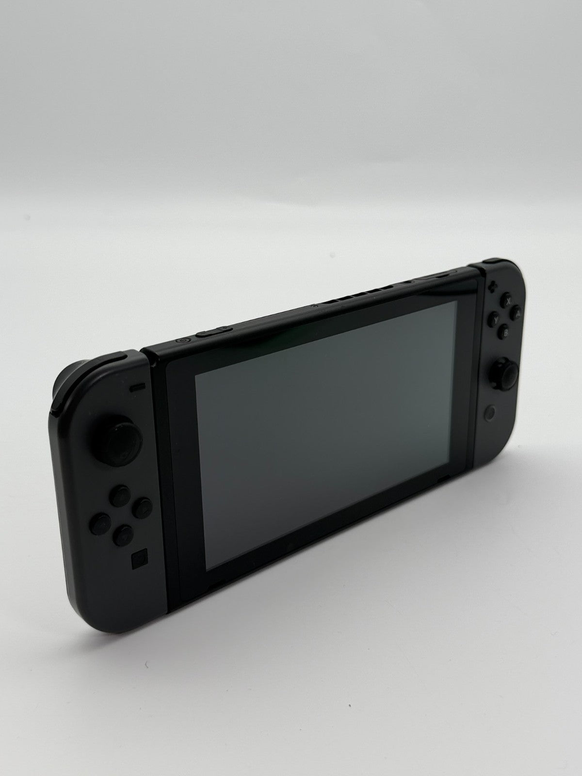 Nintendo Switch V2 Konsole Grau guter Zustand mit Originalverpackung hintere Halterung fehlt