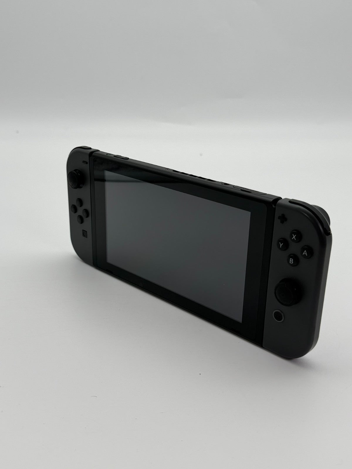 Nintendo Switch V2 Konsole Grau guter Zustand mit Originalverpackung hintere Halterung fehlt
