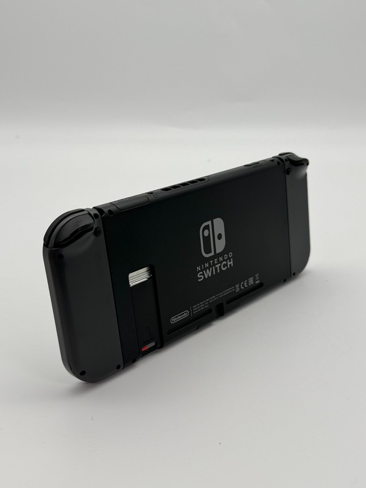 Nintendo Switch V2 Konsole Grau guter Zustand mit Originalverpackung hintere Halterung fehlt